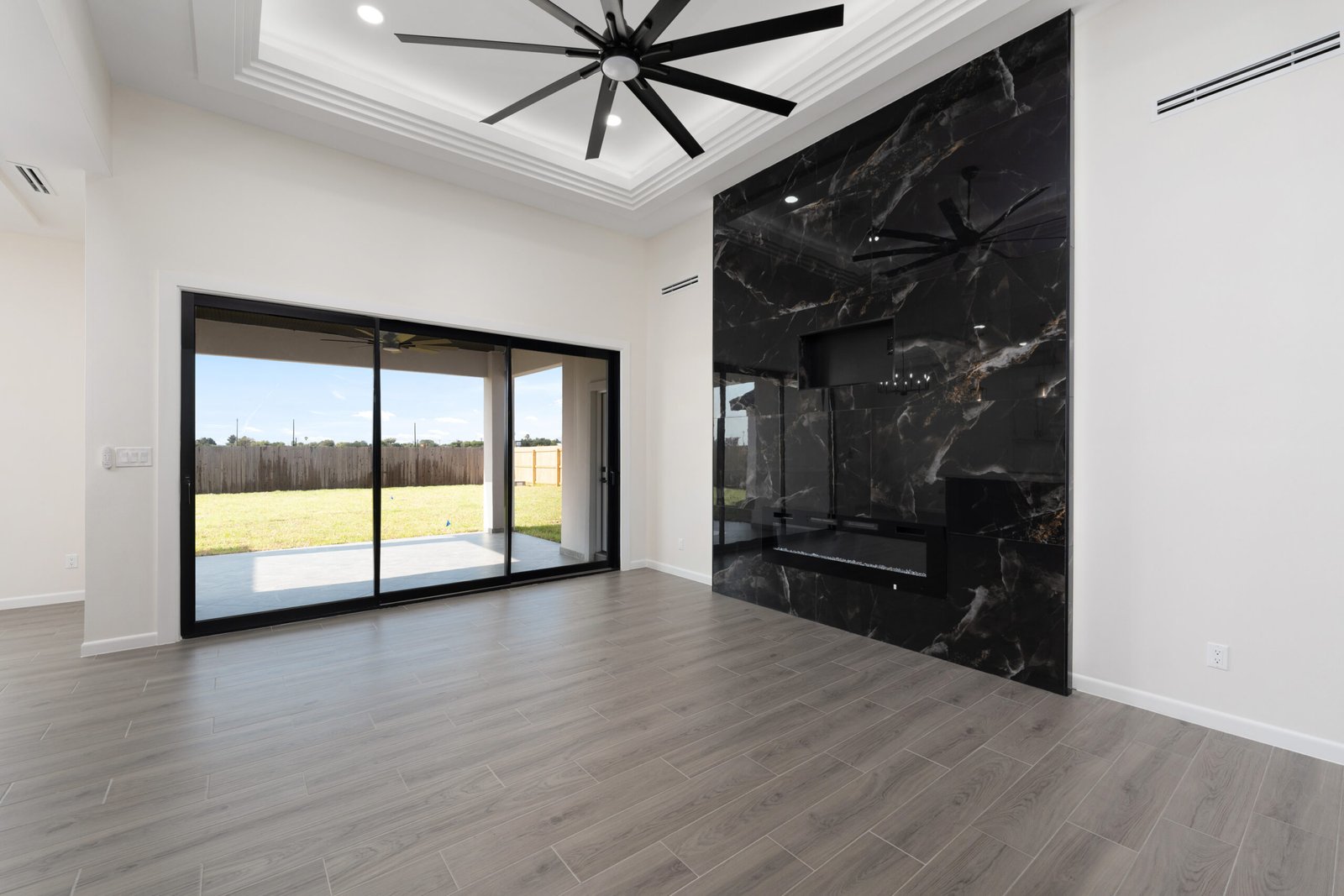 Living room with a marble fireplace wall, 1007 Bette