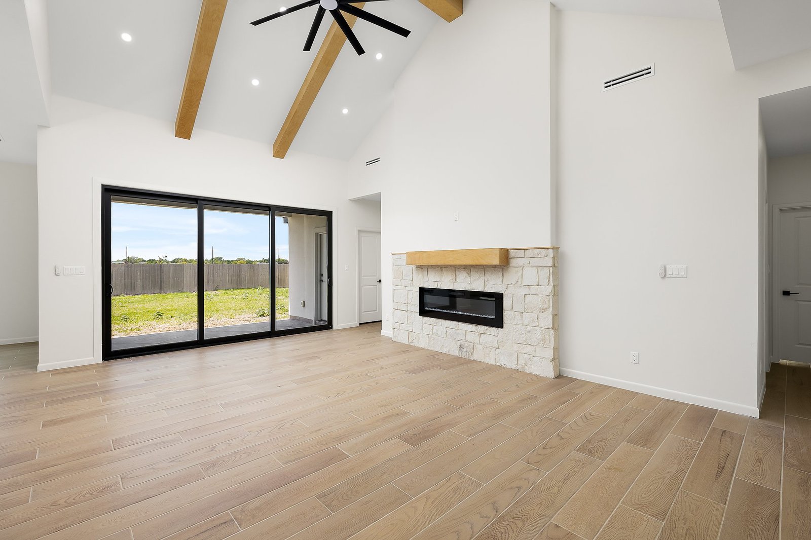 Living room with a fireplace and vaulted ceiling, 1003 Bette
