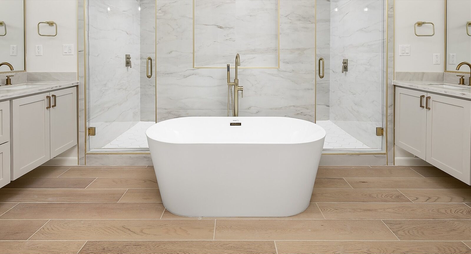 Custom bathroom with freestanding tub and marble tile