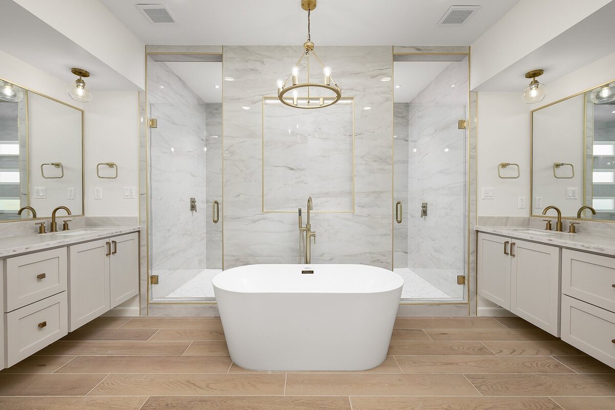 Custom bathroom with freestanding tub and marble tile